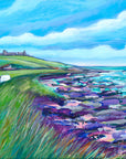 A summery painting of Dunstanburgh Catle showing three sheep grazing on the landscape with the castle behind. The sea is rolling in onto the rocks.