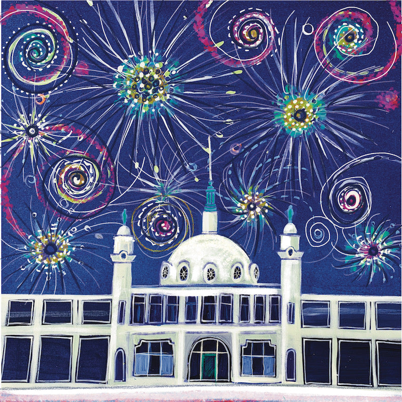 Fireworks explode against a dark sky, above Whitley Bay's white Spanish City Dome.  