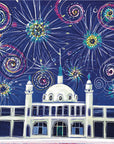 Fireworks explode against a dark sky, above Whitley Bay's white Spanish City Dome.  