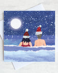 A Christmas Card featuring Sea swimmers in Santa Hats.